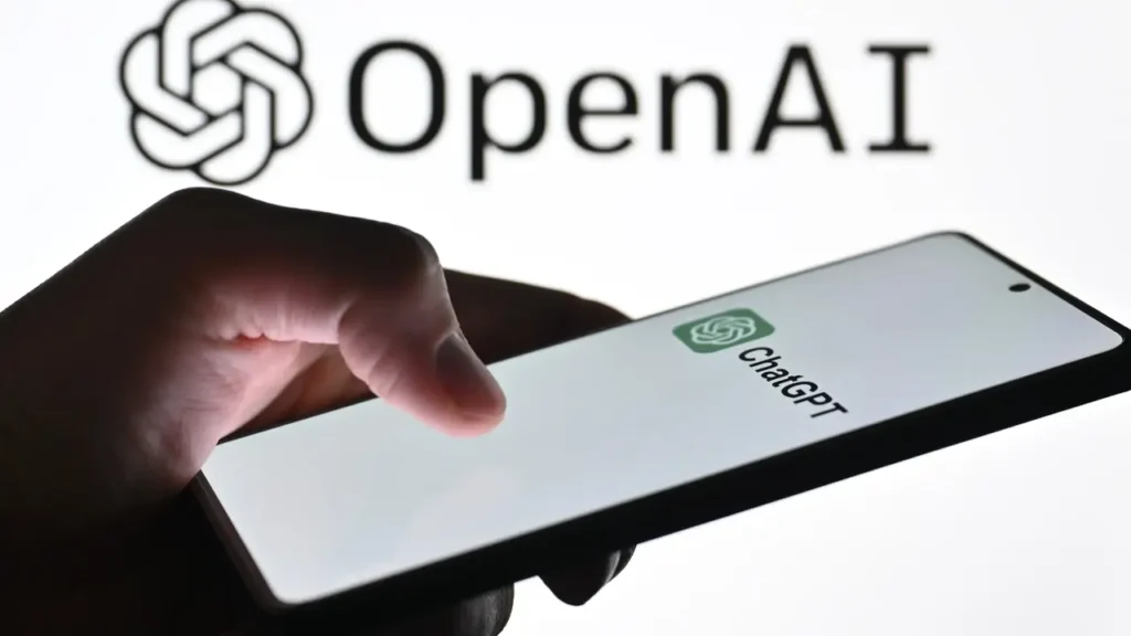 Close-up of a hand using the ChatGPT mobile application on a smartphone.